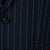 Navy pinstripe suit jacket with a button detail