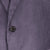 Close-up of a textured purple fabric with a button